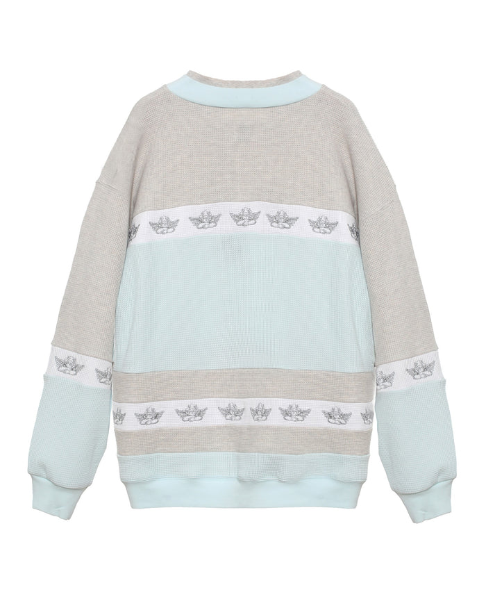 Sweatshirt with light blue and beige design on a white background