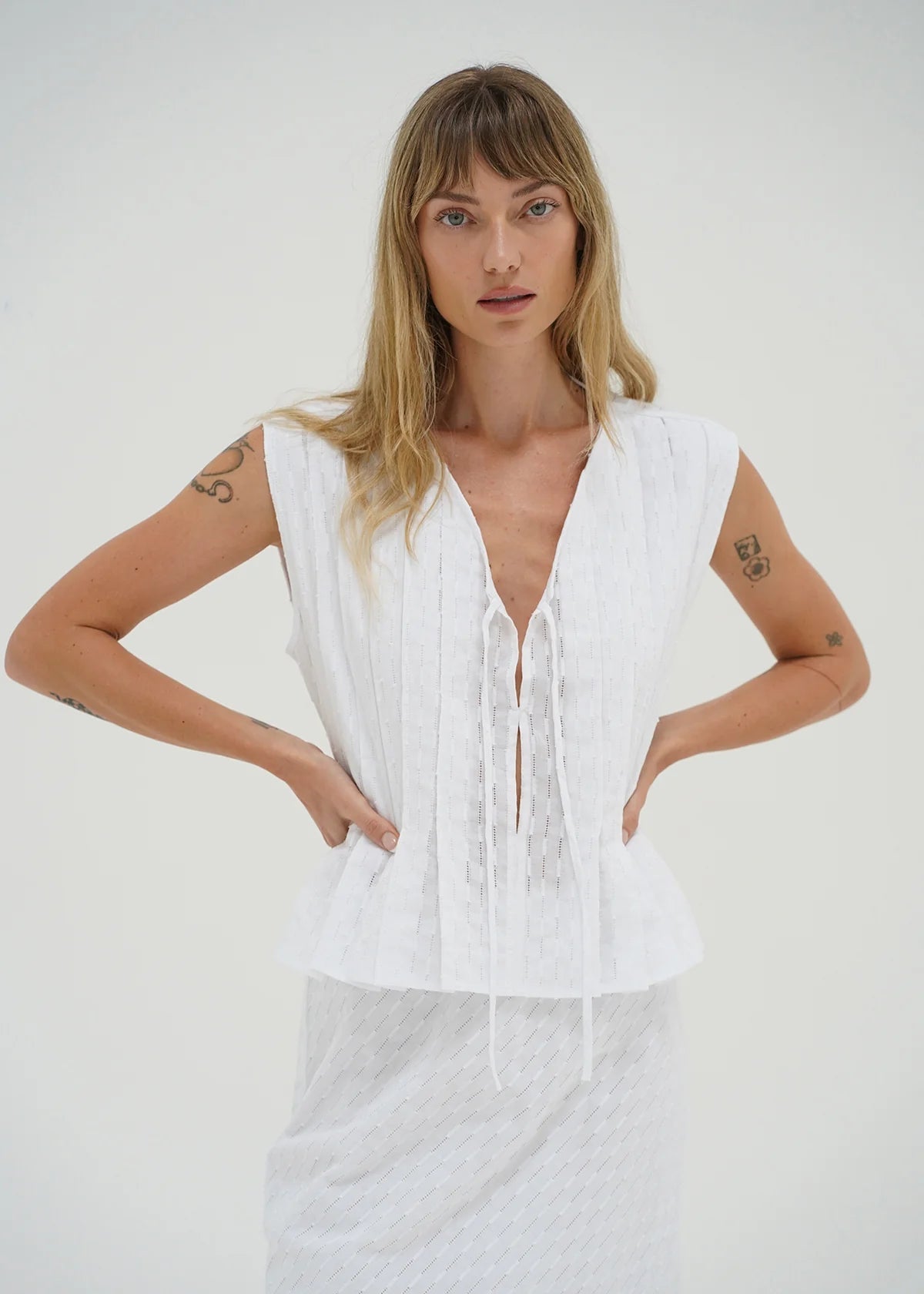 white eyelet top. summer blouse. spring top. spring style. spring trends. lna clothing. lna clothing near me. stores near me. boutiques near me. white top. bridal top.