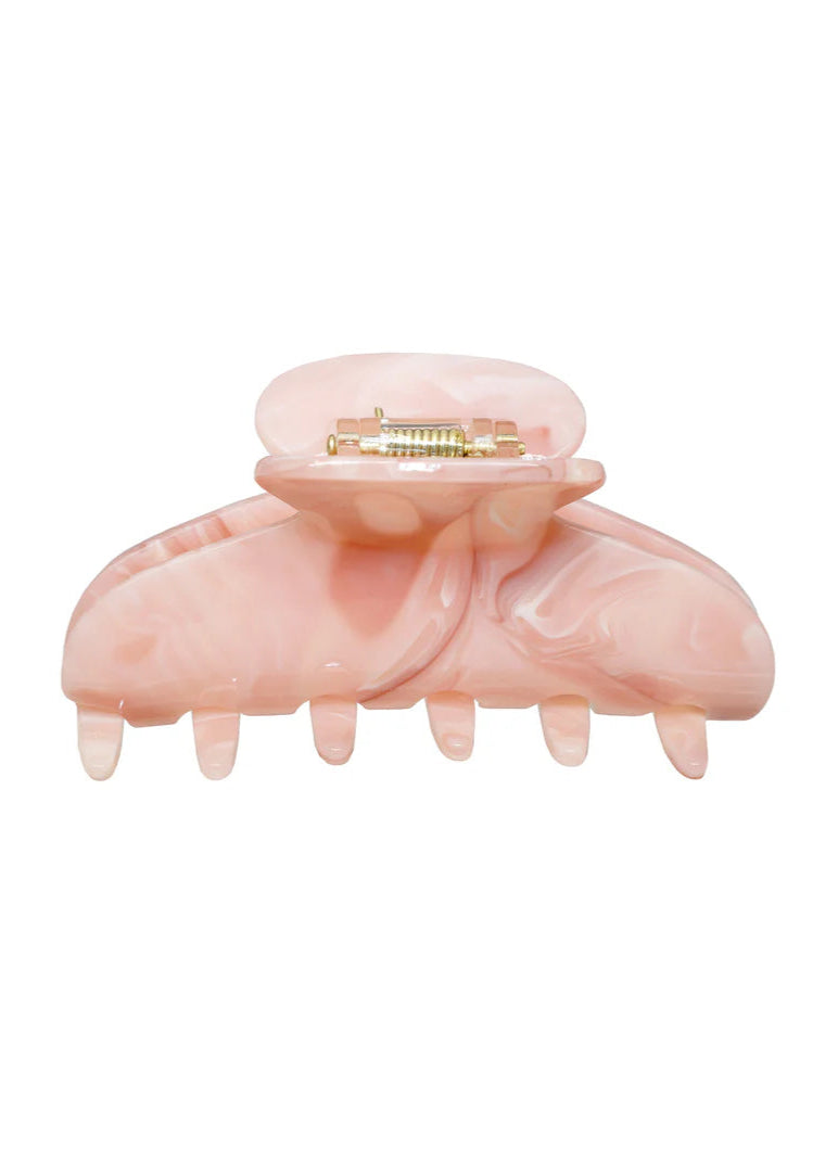 Pink hair clip on a white background