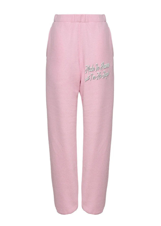 Pink sweatpants with text on a white background