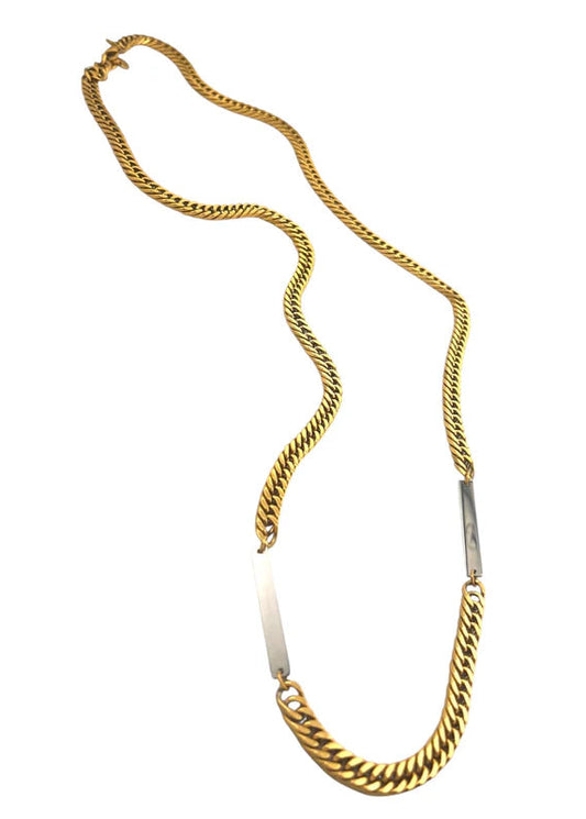 Gold chain necklace on a white background