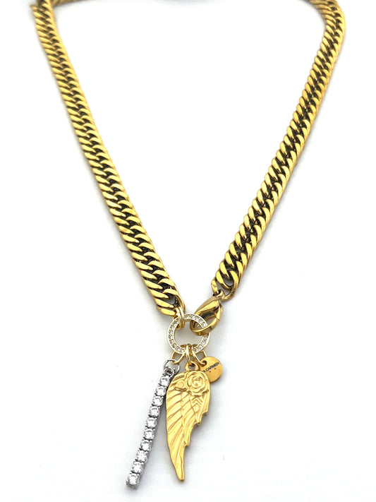 Gold chain necklace with a wing and sword pendant on a white background