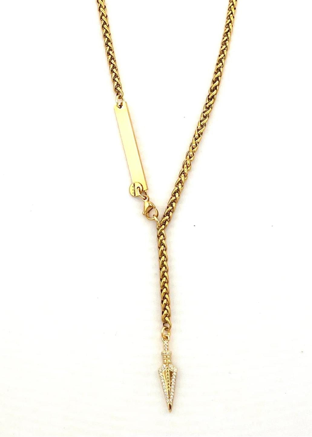 Gold necklace with a pendant on a white background