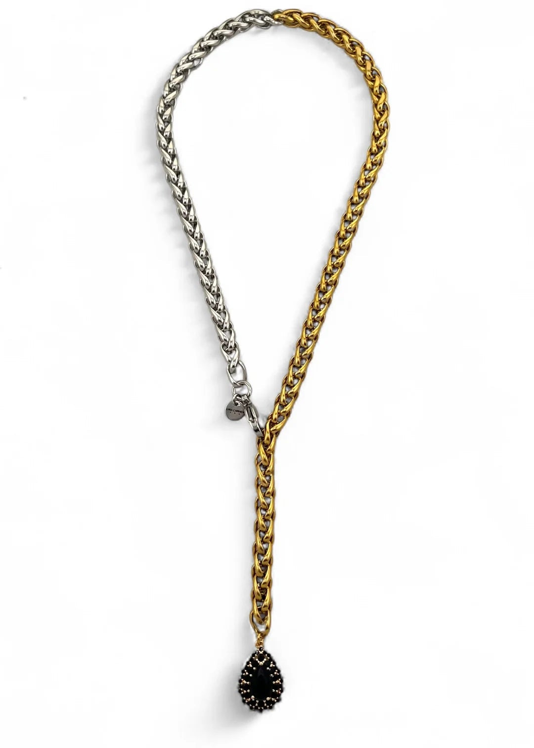 Two chain necklaces, one gold and one silver, with a black teardrop pendant on a white background.